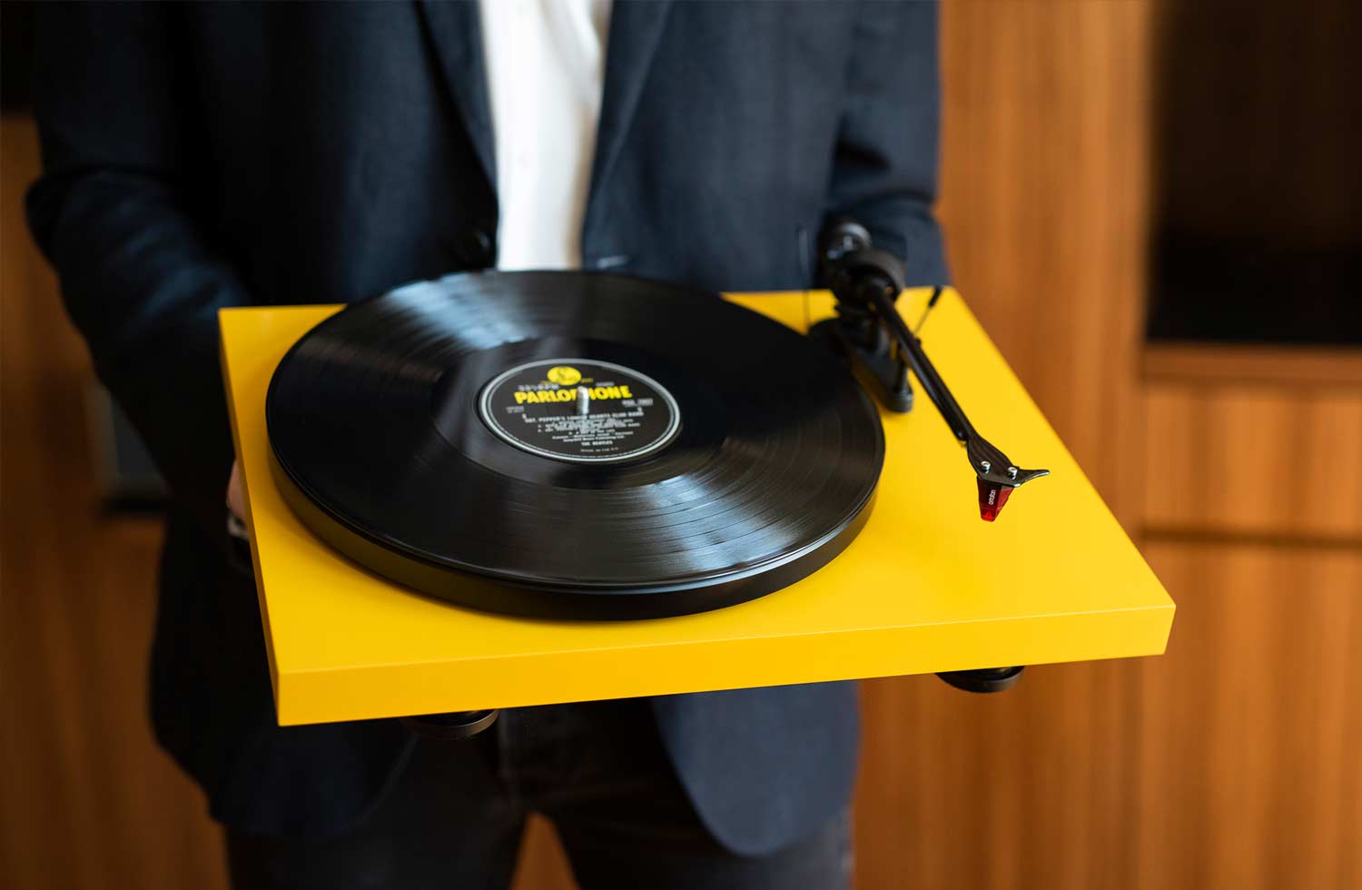 Yellow Pro-Ject turntable with a vinyl record, from the Audio Tuning selection