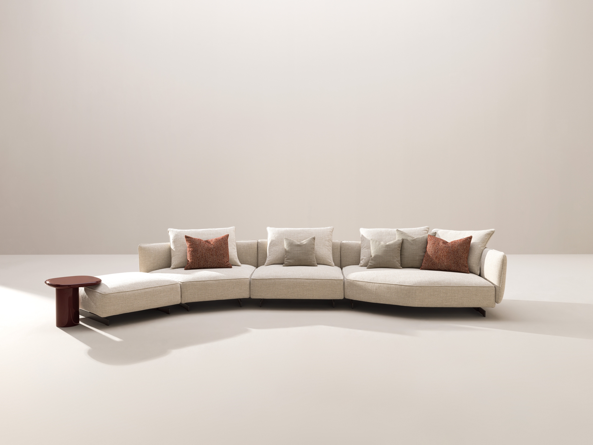 Désirée Homan modular sofa with light upholstery and loose cushions.