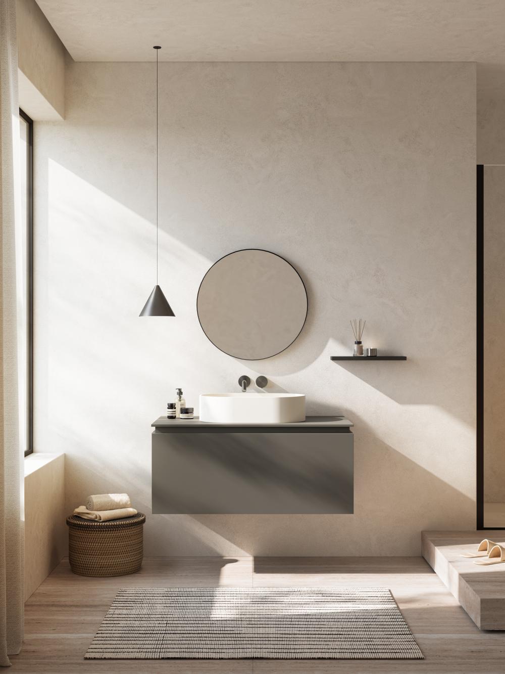 Karol Amiata bathroom cabinet with a white countertop basin and circular mirror.